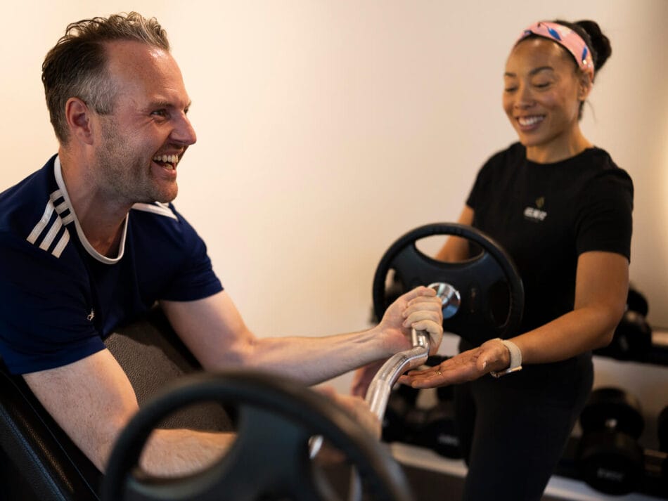Personal trainer met client